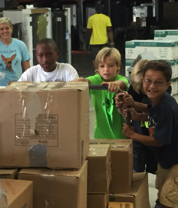Young Volunteers of the HeadKnowles Foundation at the Furniture Plus  Distribution Center, after 2015 Hurricane Joaquin